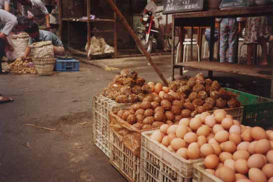 Different kinds of eggs on display at an outdoor market in Shanghai. 